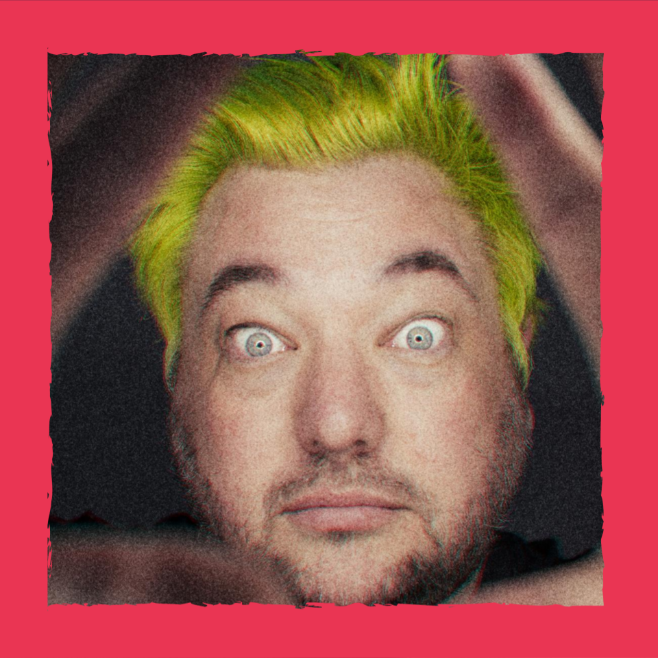 A close up self portrait of byjono with yellow hair and his hands framing his face